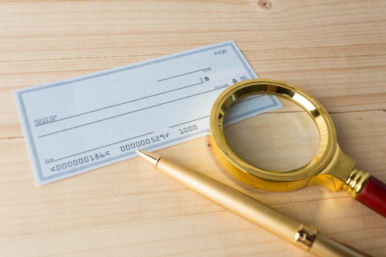 Banking Check with magnifier glass